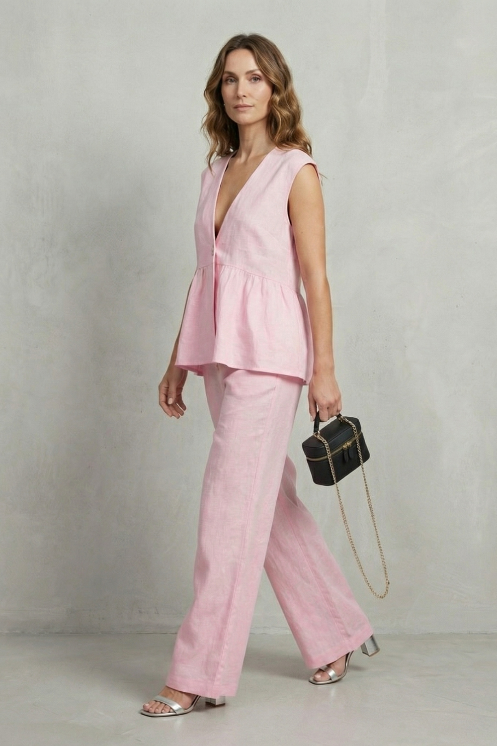 Back view of the sleeveless ruffle-hem top and straight-leg pants