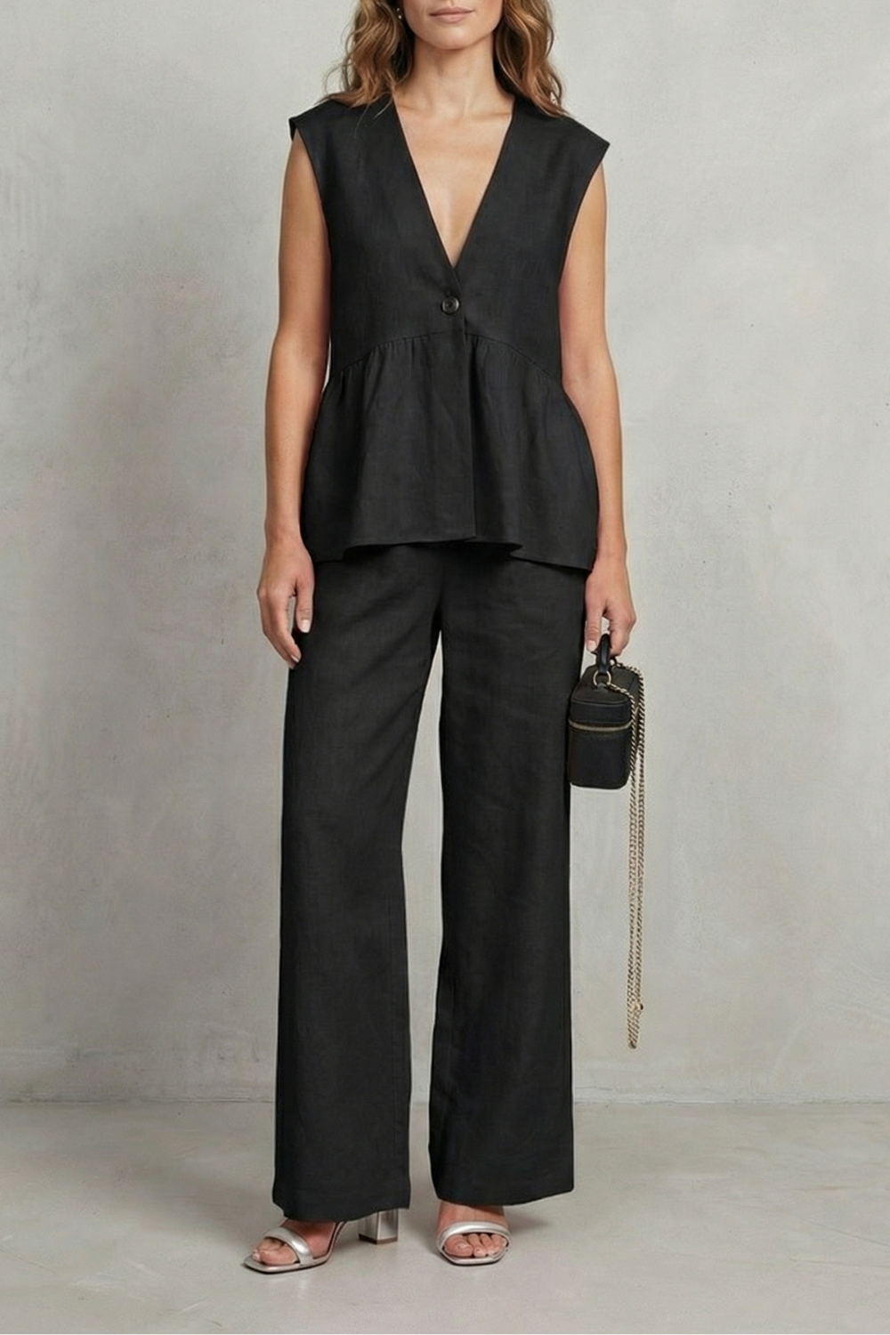 Blue colorway of the sleeveless ruffle top and straight-leg pants set