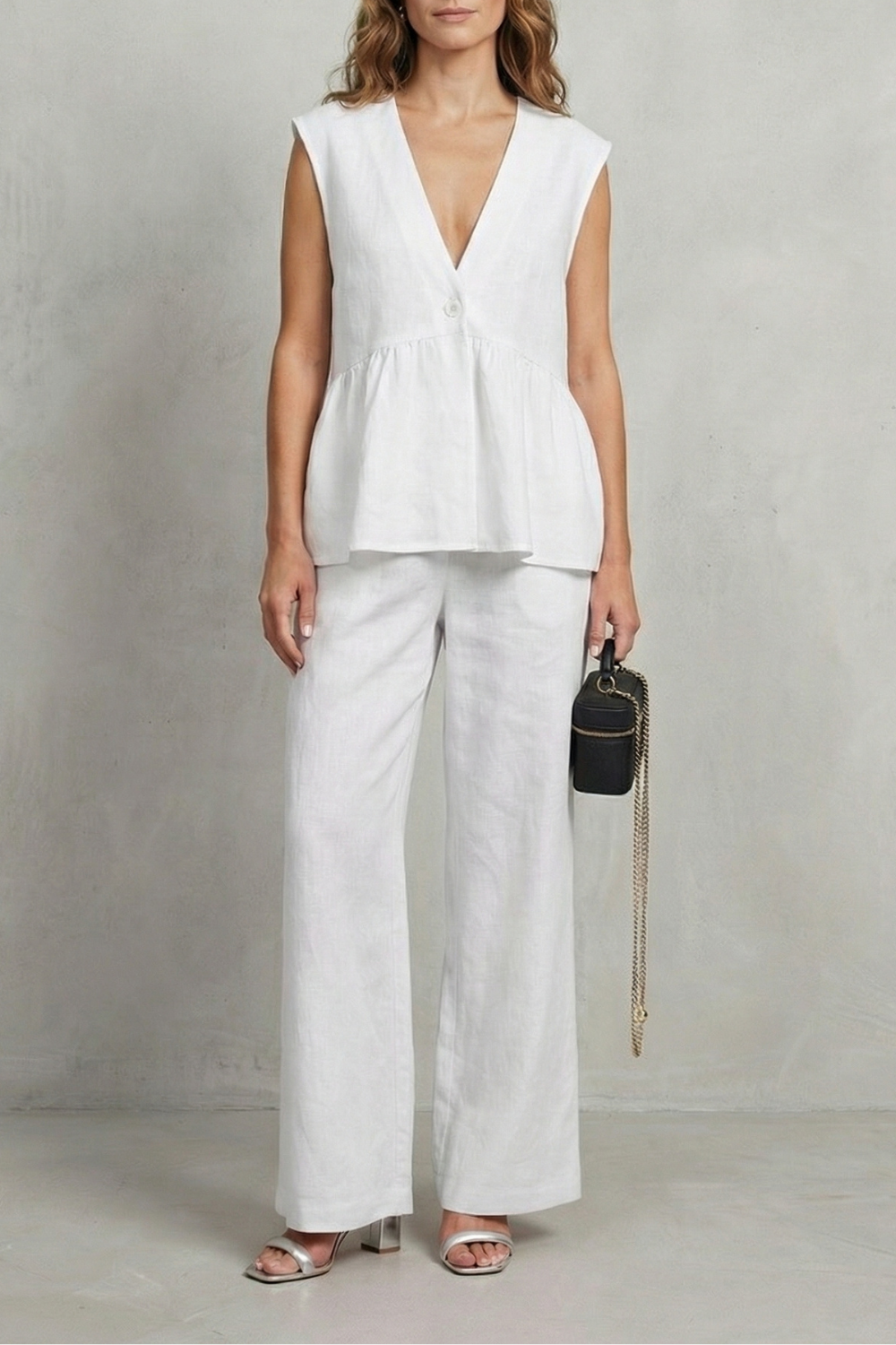 White colorway of the sleeveless ruffle top and straight-leg pants set