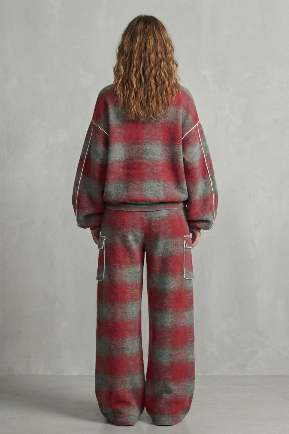 Detail close-up of the distressed plaid weave and contrast piping
