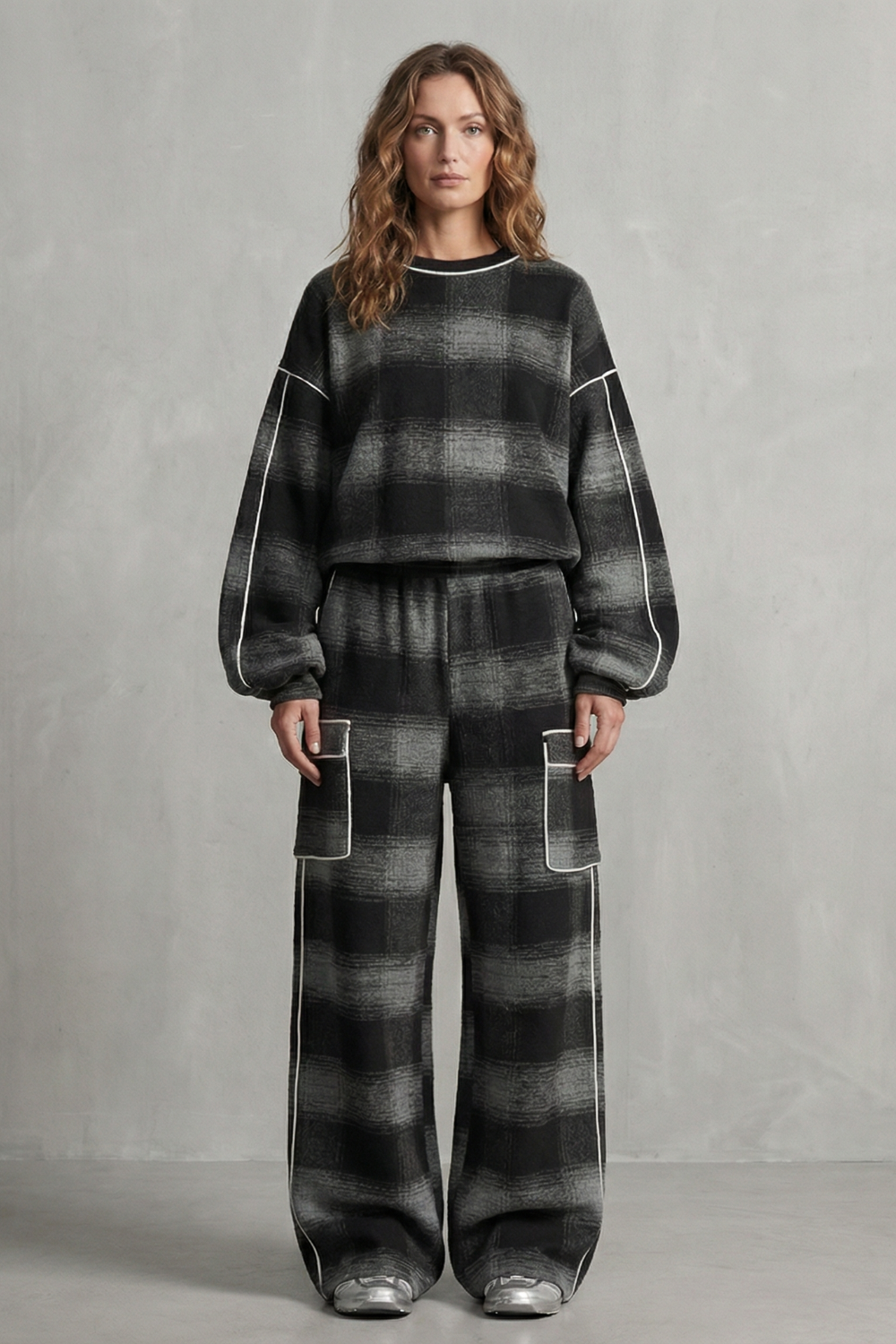 Detail of the patch pockets on the plaid wide-leg pants
