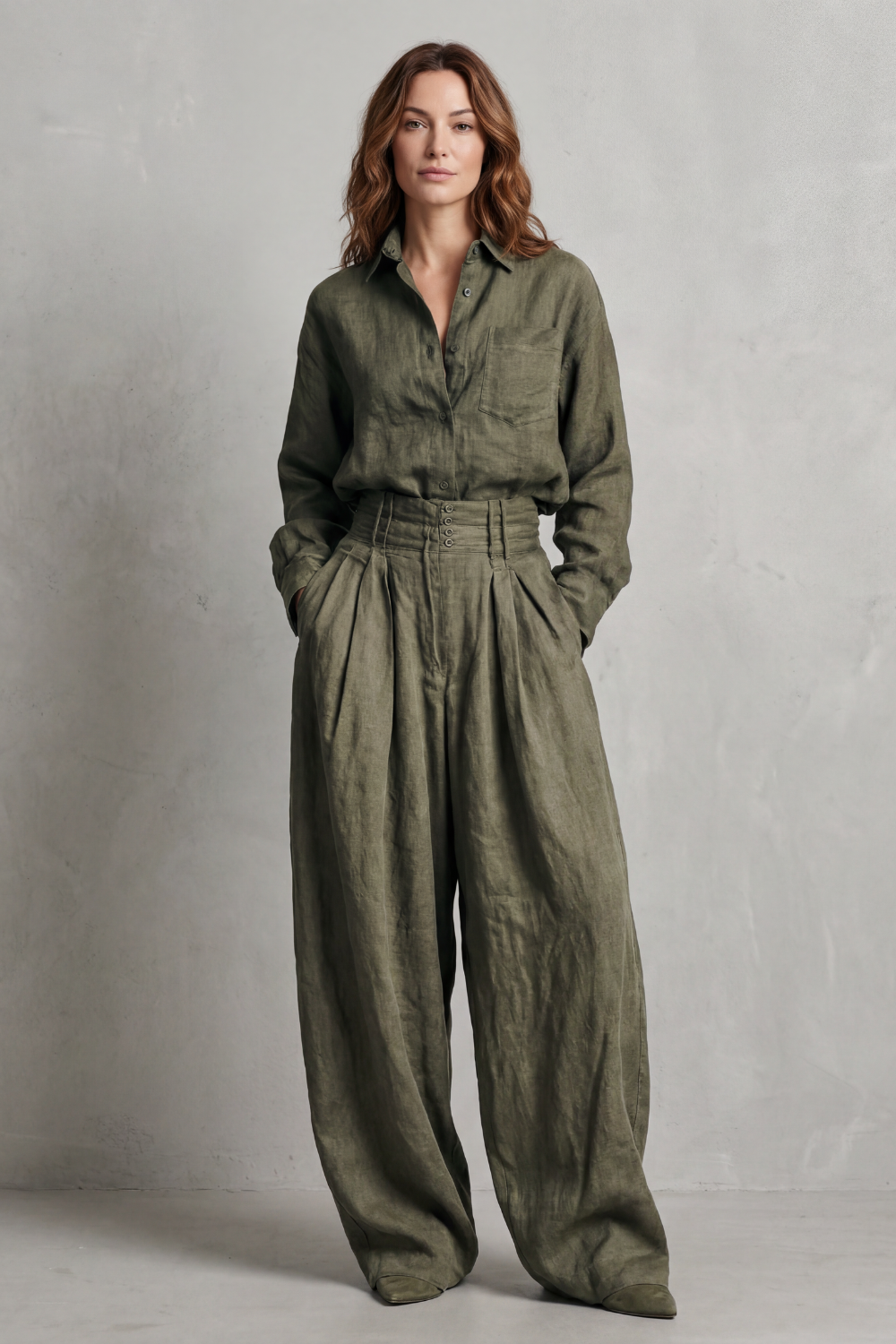 Side view of the oversized shirt and pleated wide-leg pants set
