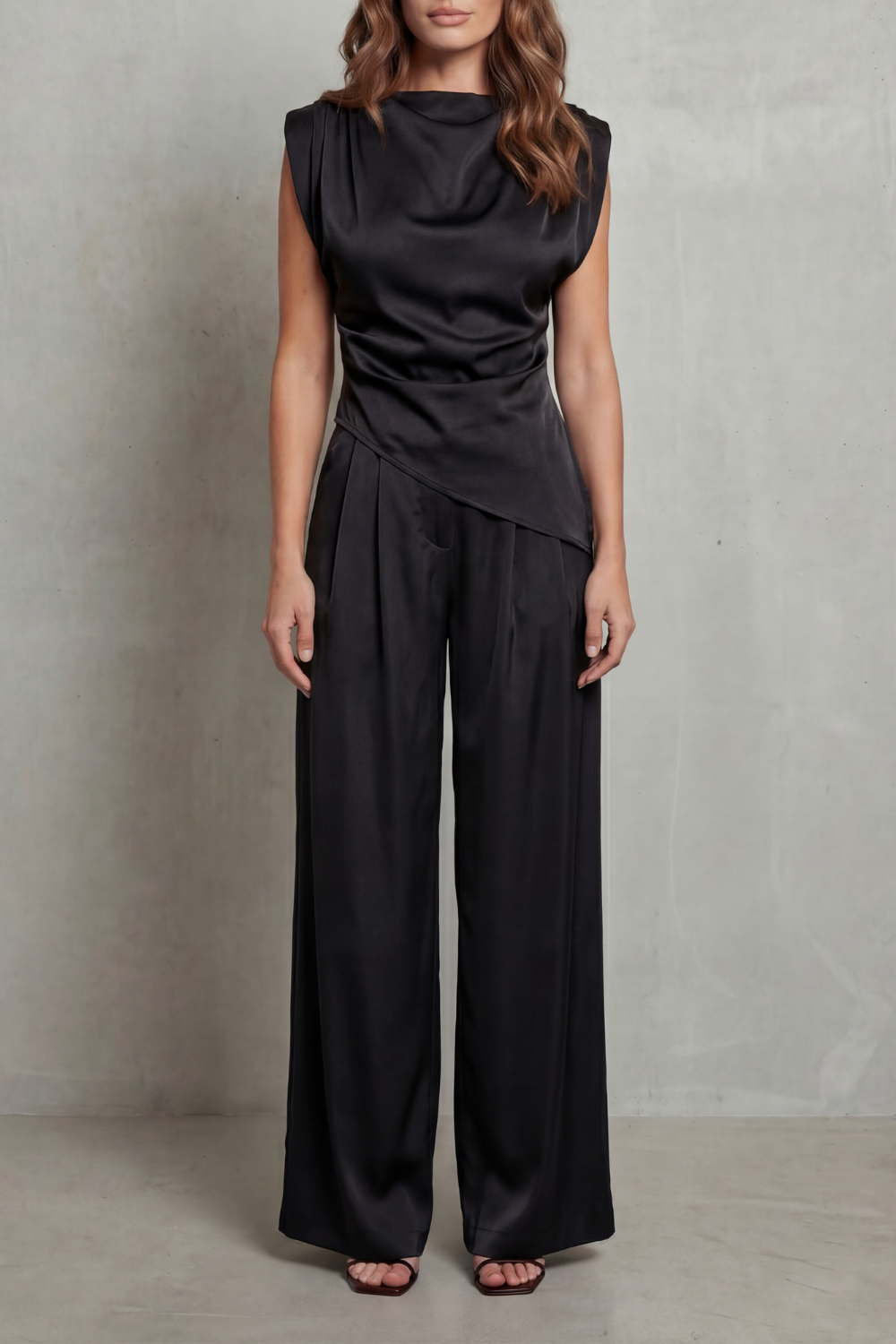 Black colorway of the draped-waist top and pants set, full-length view