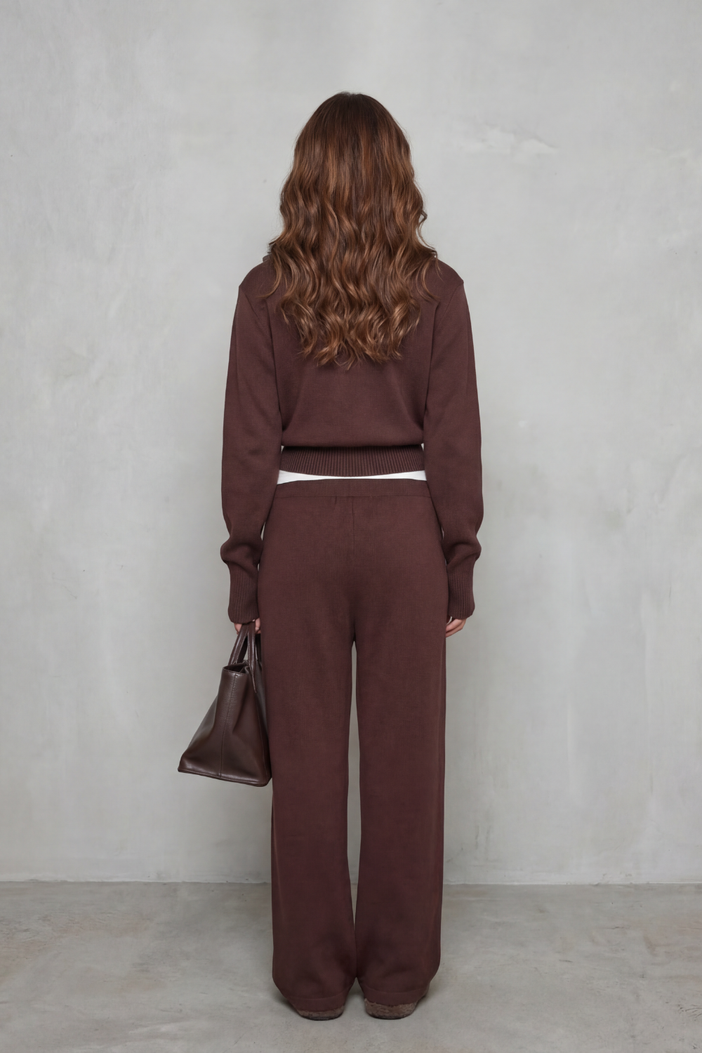 Detail close-up of the zip-up front and high neck collar