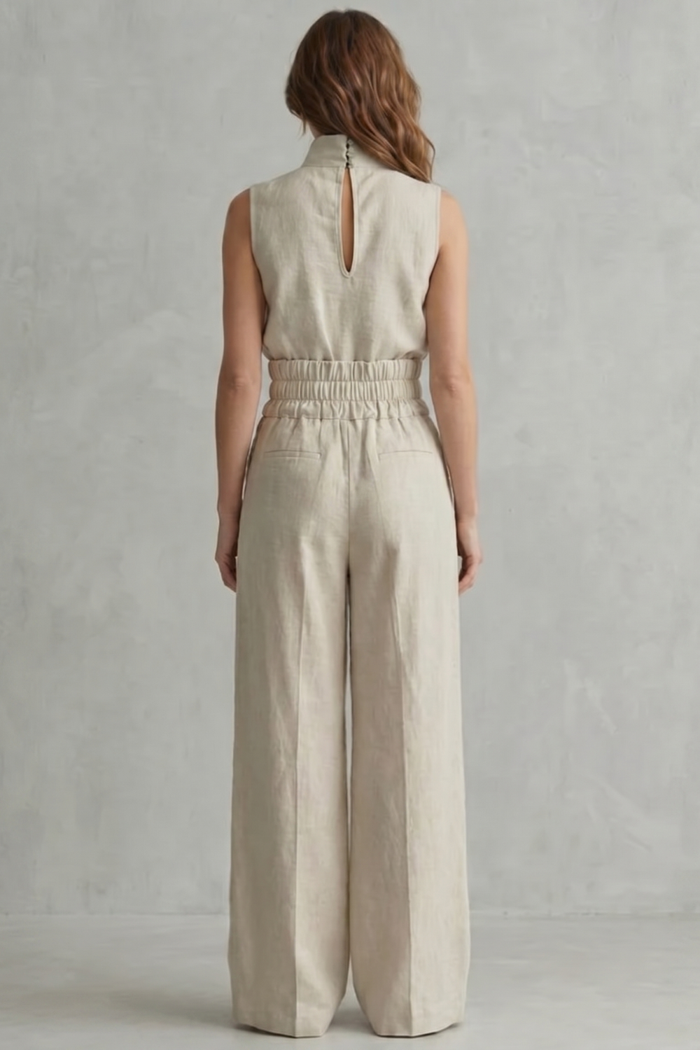 Detail close-up of the high neckline and clean shoulder seams