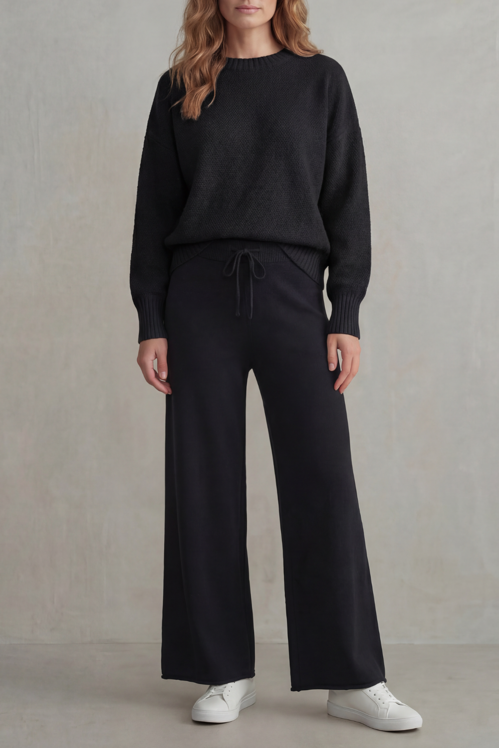 Detail of the adjustable drawstring waist on the knit pants