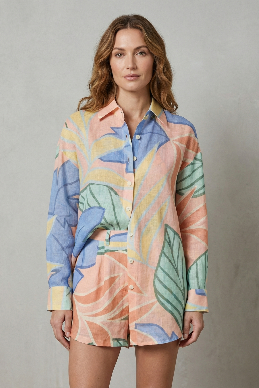 Side view of the tropical print shirt and shorts two-piece set