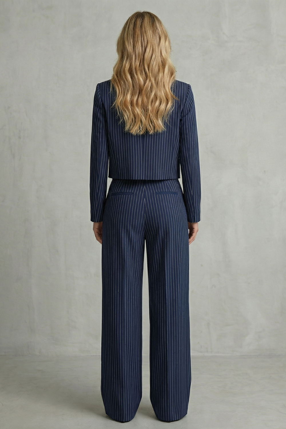 Detail close-up of the sharp lapels and vertical stripe pattern