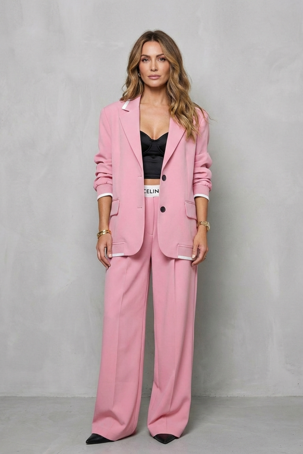 Pantsuit styled over a fitted crop top for a casual look