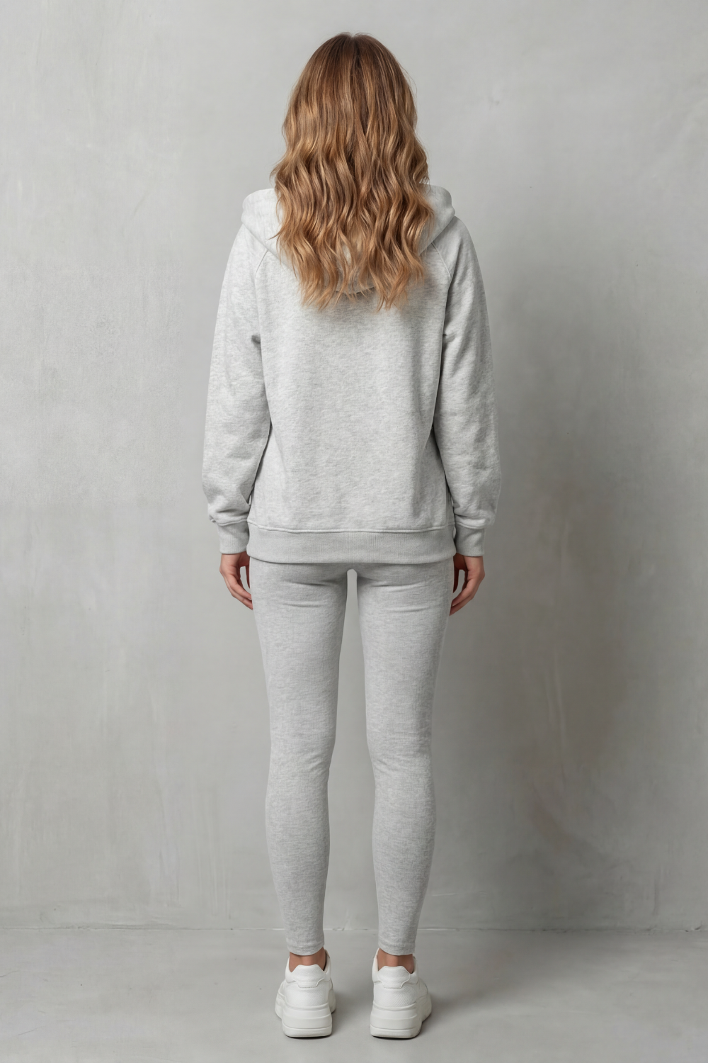 Detail close-up of the statement button placket on the hoodie