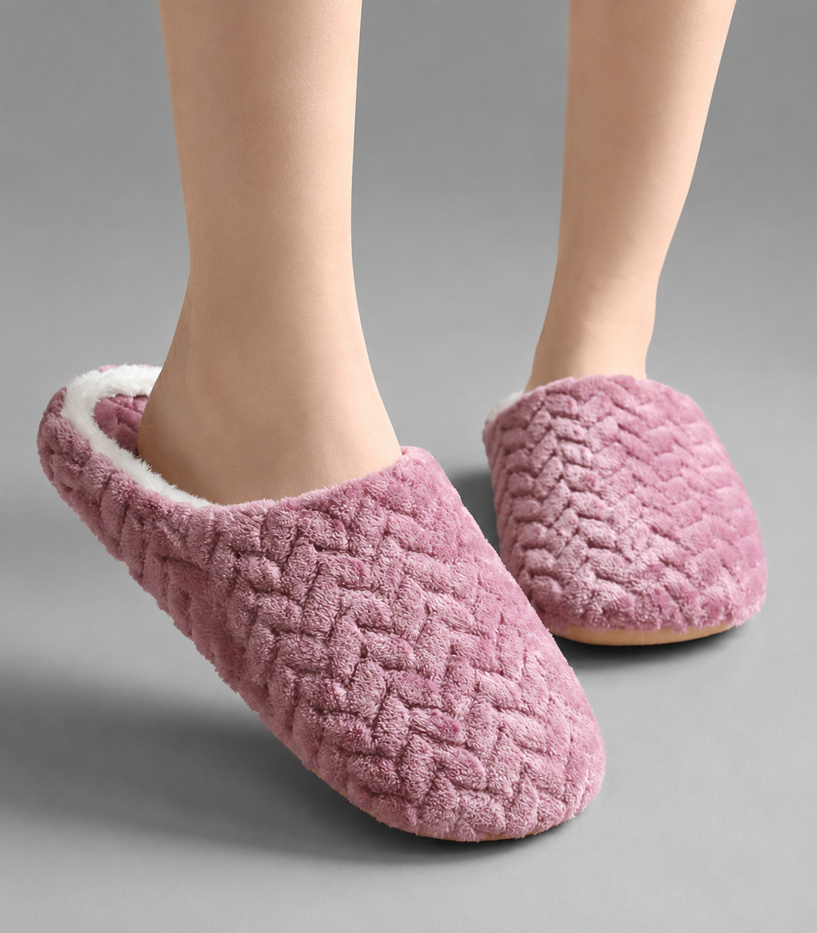 Unisex plush house slippers with a soft cloth upper, cozy lining, open-back slip-on design, cushioned sole, and non-slip outsole.