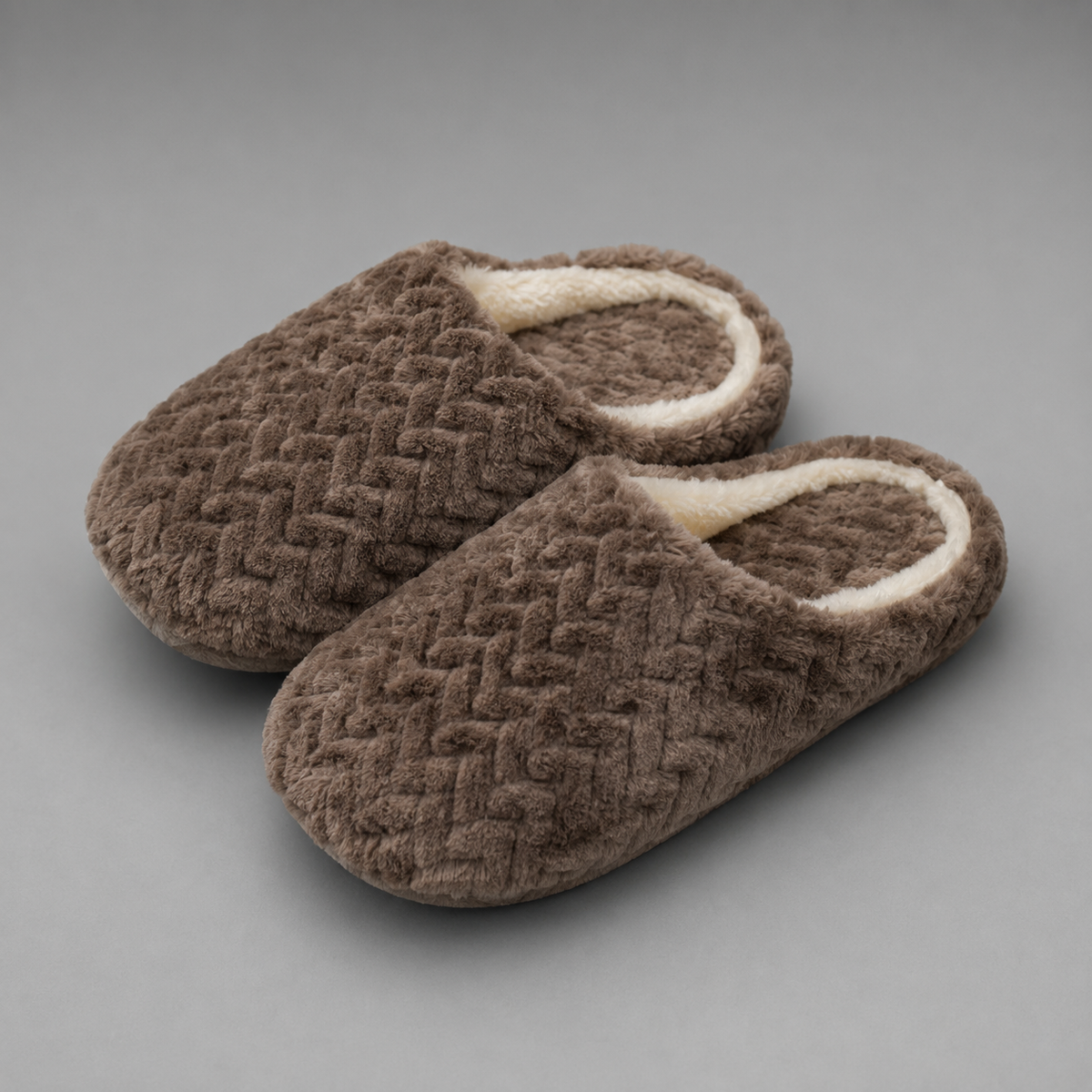 Unisex plush house slippers with a soft cloth upper, cozy lining, open-back slip-on design, cushioned sole, and non-slip outsole.