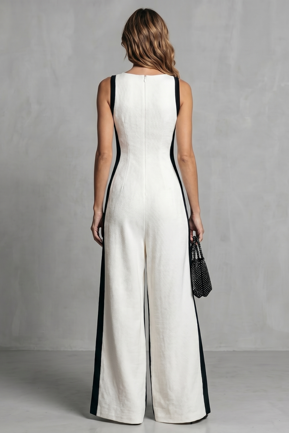 Detail close-up of the deep V-neckline and side pocket