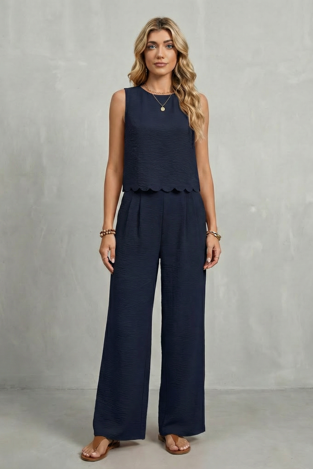Black colorway of the open-back top and wide-leg pants set, full-length view