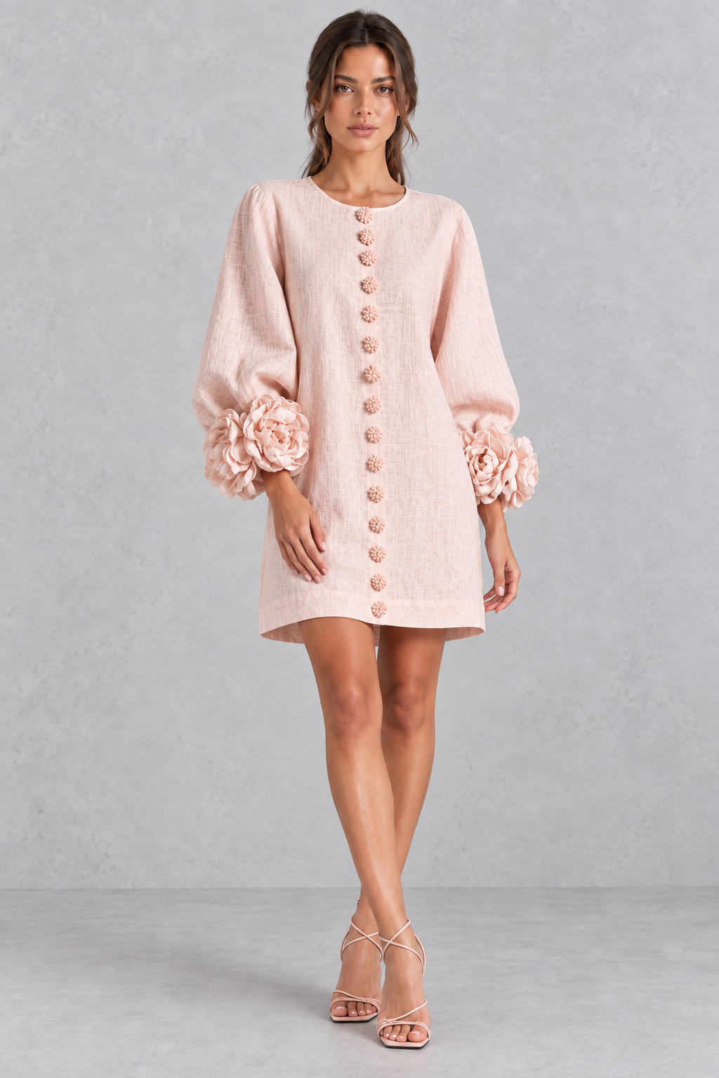 Woman wearing a cotton-linen 3D floral mini dress with lantern sleeves, ideal for brunch.