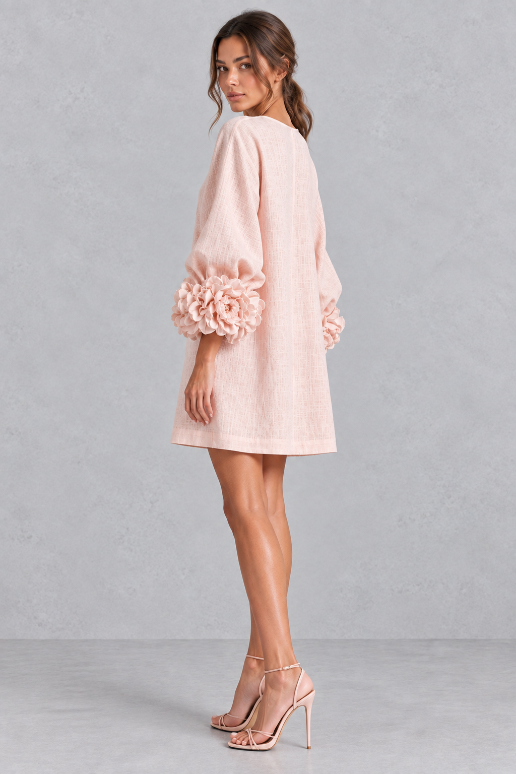 Front view of a women's round neck A-line mini dress with 3D flower embellishments.