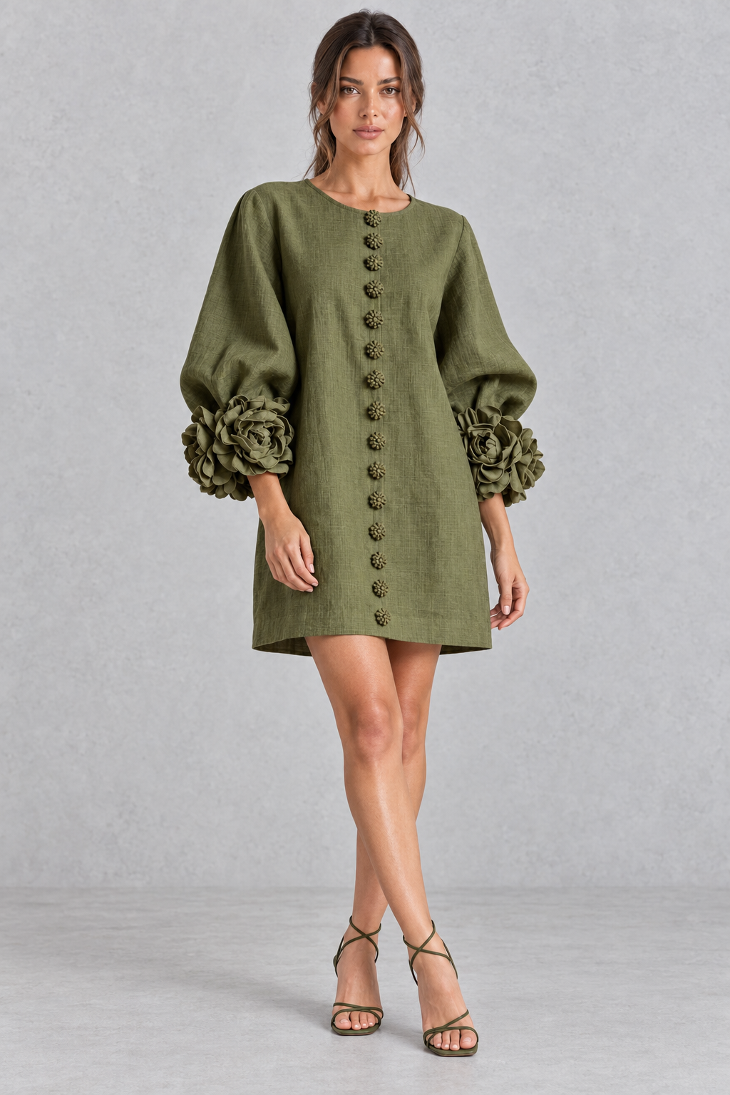 Detail of the lantern sleeve cuff on a women's 3D floral mini dress.