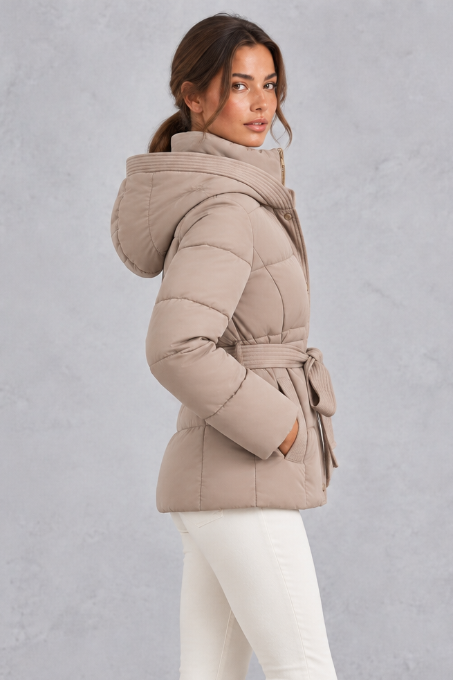 Back view of belted quilted puffer jacket with padded hood