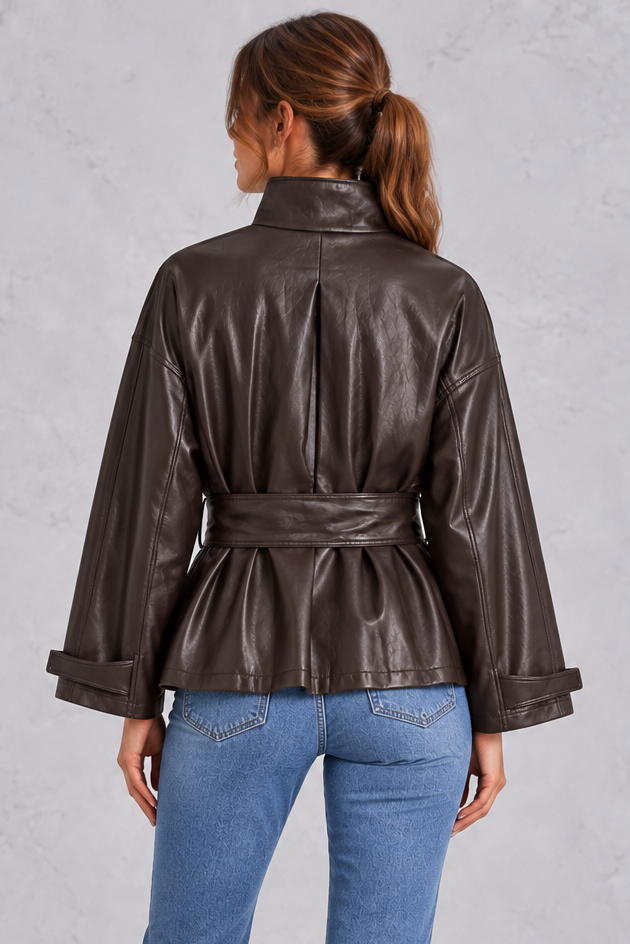 Coordinating waist belt cinched on the cropped jacket