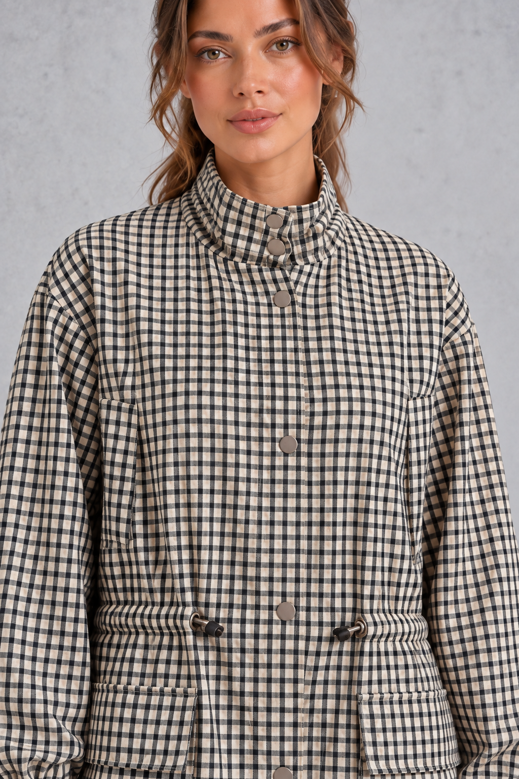Close-up of the check pattern and snap-button front