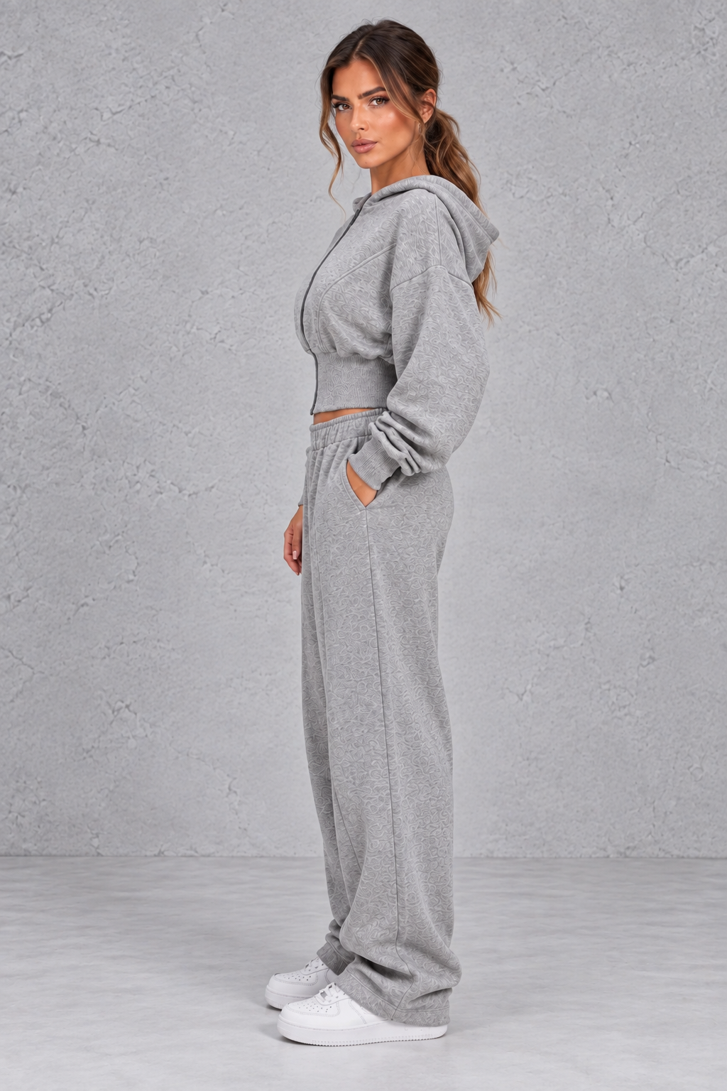 Back view of the cinched waist hoodie showing dropped shoulders and hood
