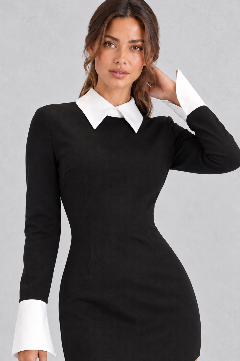 Close-up of the turn-down collar and ribbon detailing on a patchwork mini dress.