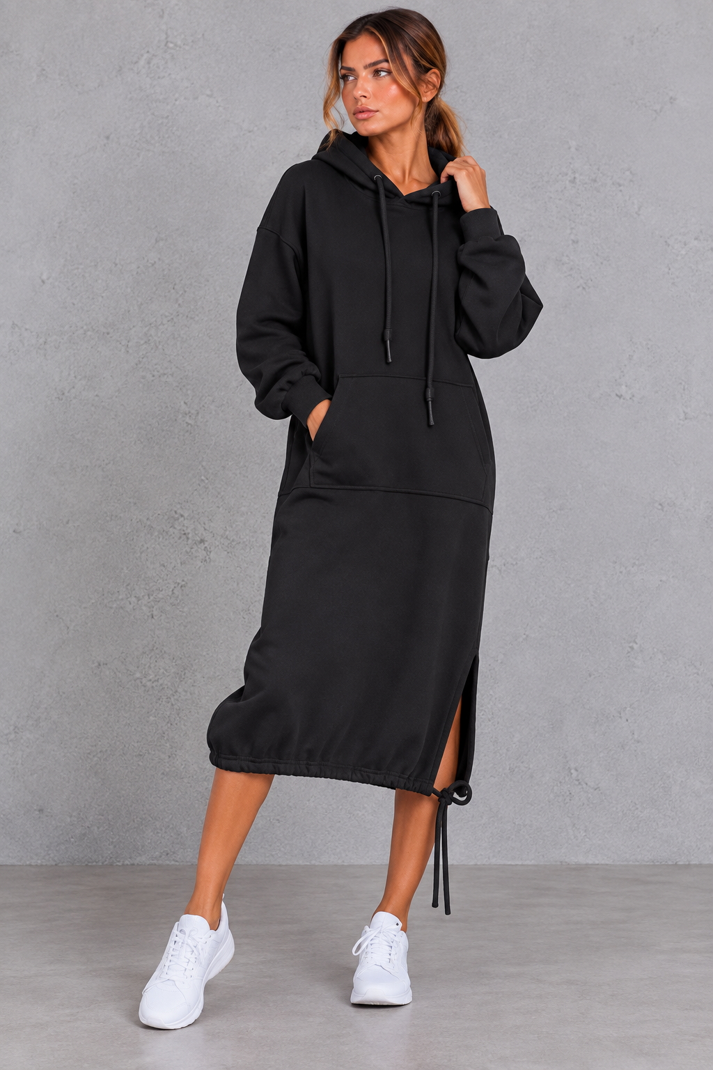 Relaxed women's hoodie dress with side split styled for travel and days out