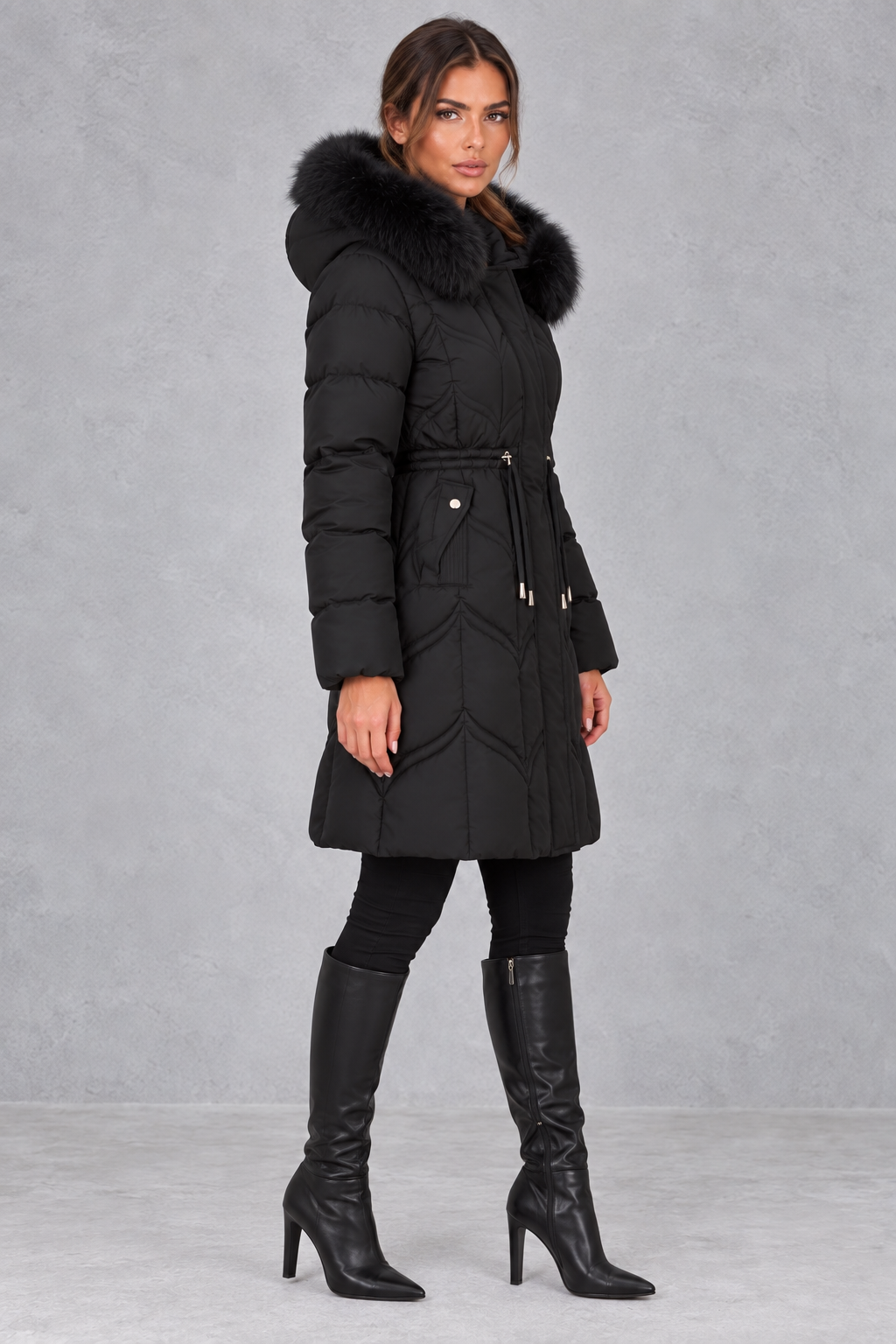 Back view of women's hooded puffer parka showing longer length