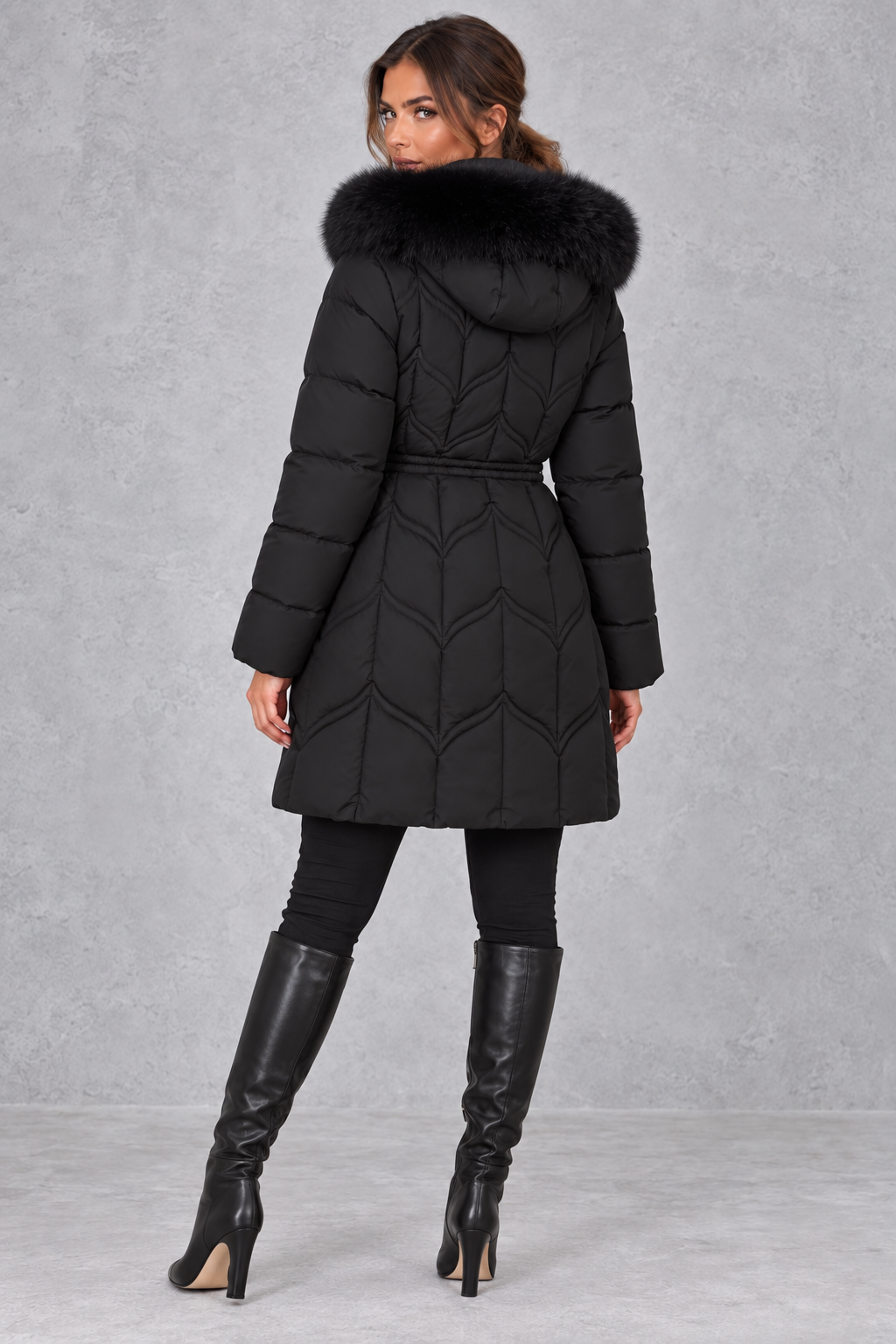 Puffer parka styled with drawstring waist cinched