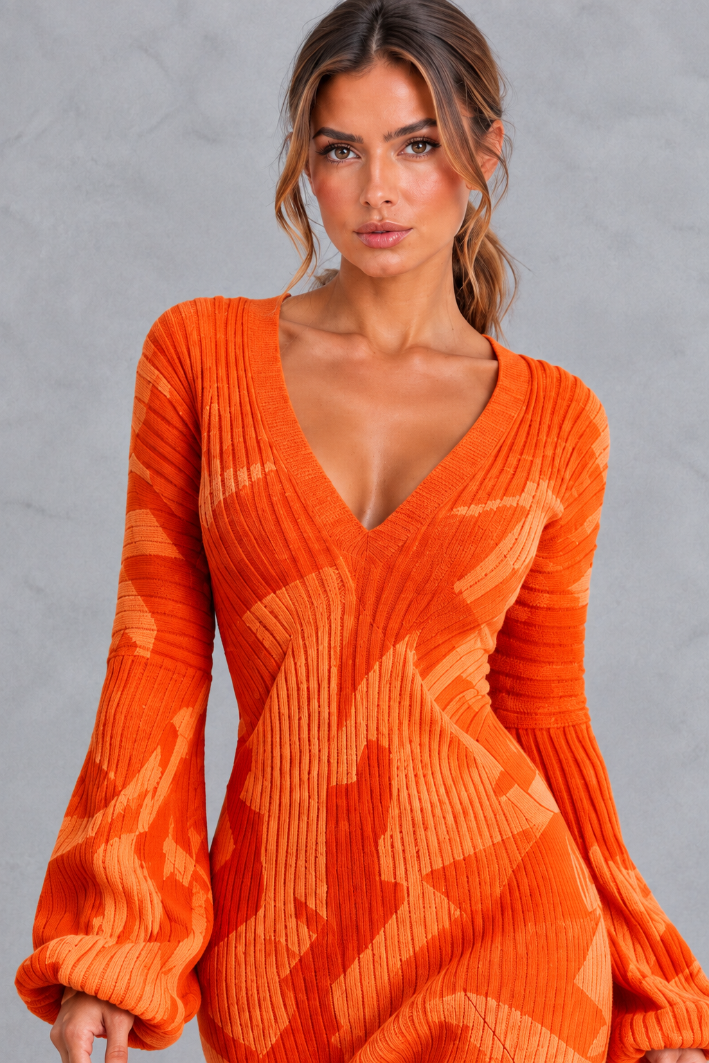 Close-up of the full fringe trim on a women's knit midi dress
