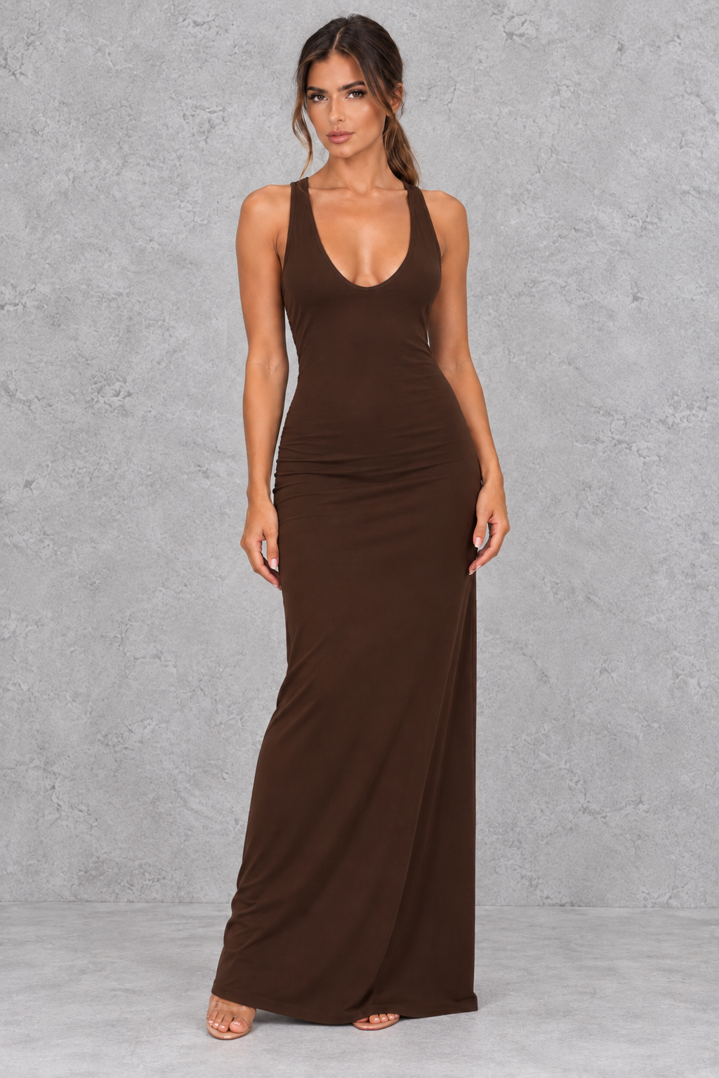 Minimalist bodycon maxi dress with open back, an elegant choice for holiday parties.