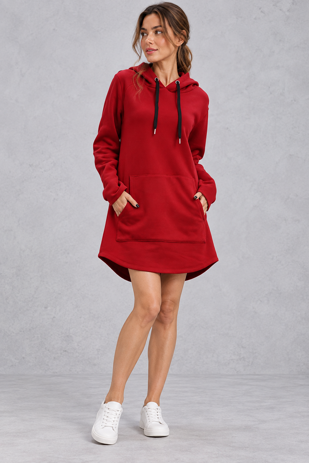 Women's long sleeve sweatshirt dress layered for fall with ankle boots