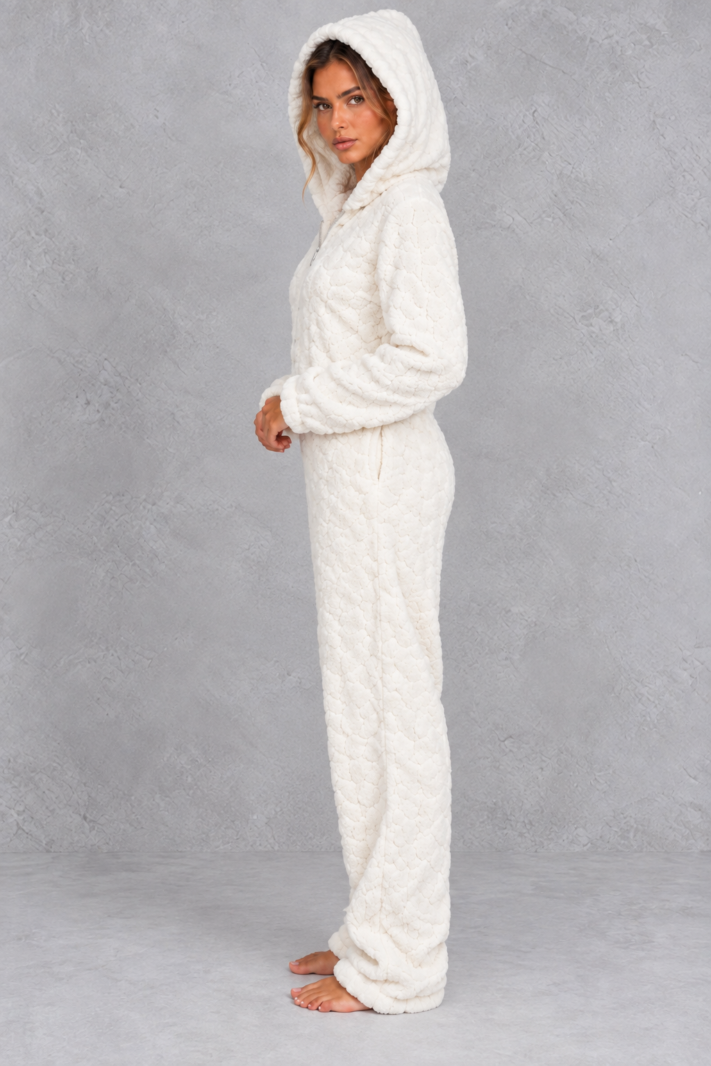 Back view of the teddy fleece jumpsuit showing the large hood