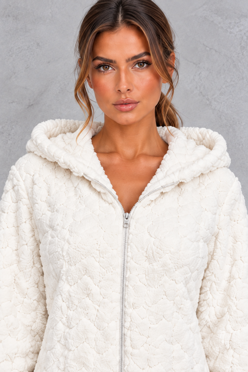 Detail close-up of the fluffy teddy fleece texture and front zipper