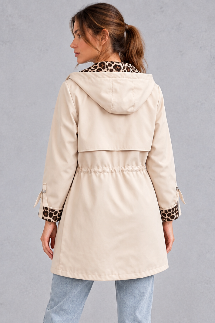 Drawstring waist and flap pocket detail on the windproof jacket