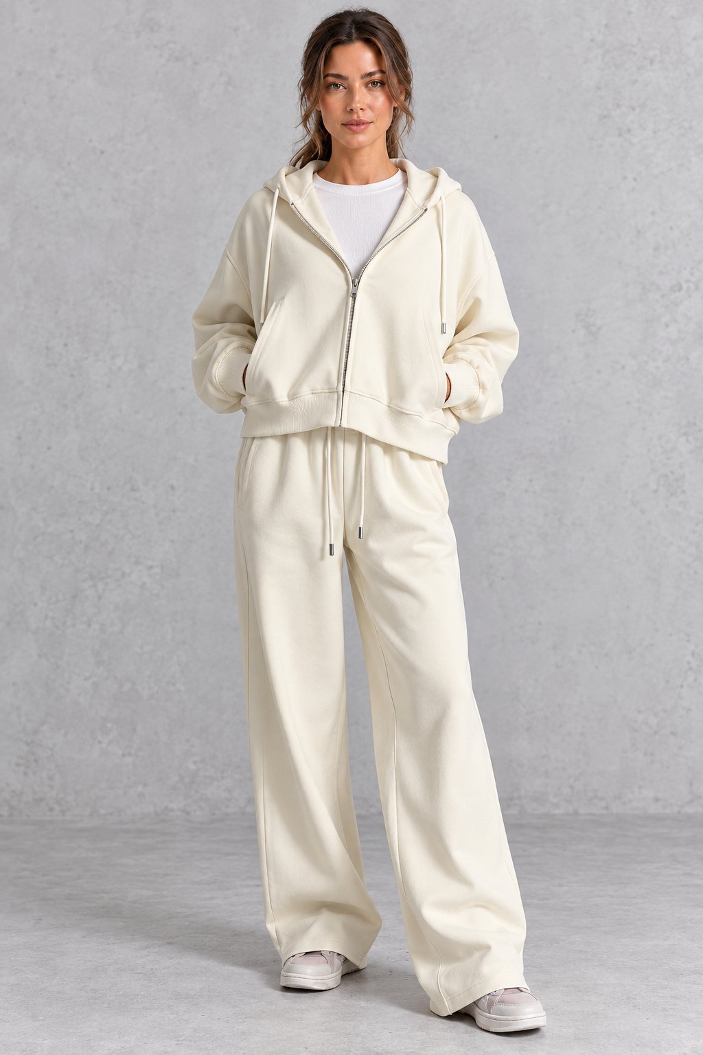 Women's cropped zip-up hoodie and high-waisted wide leg joggers set, front view