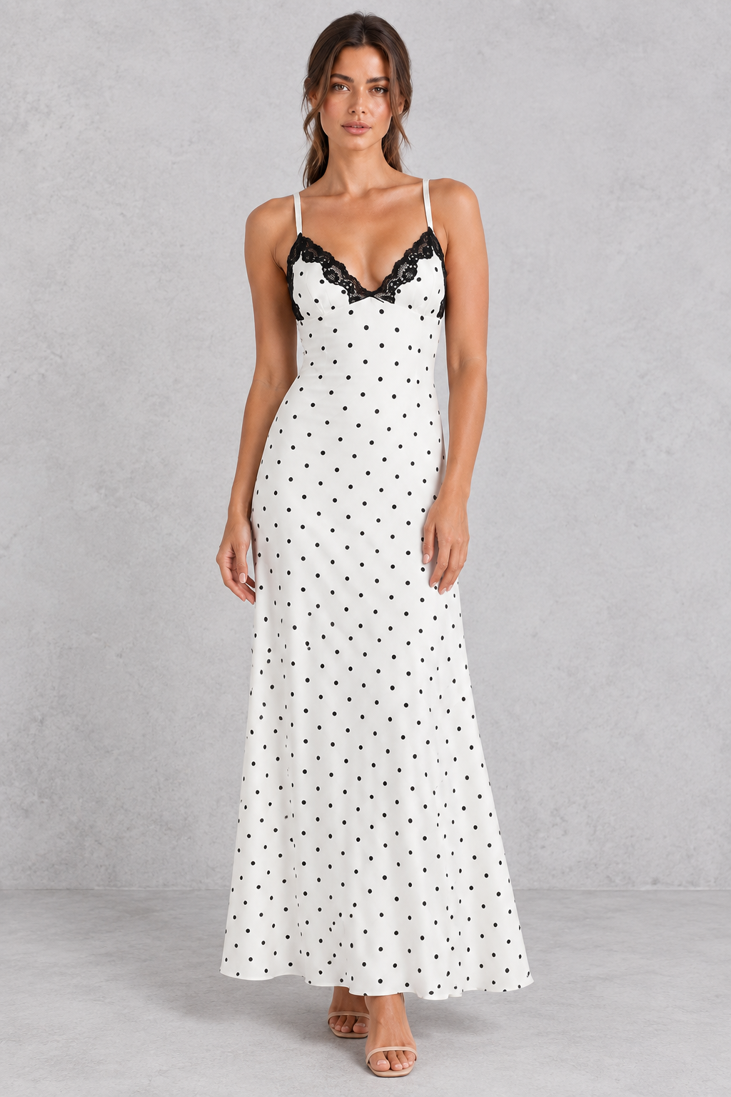 Woman wearing a lace patchwork V-neck maxi dress, ideal for cocktail parties.