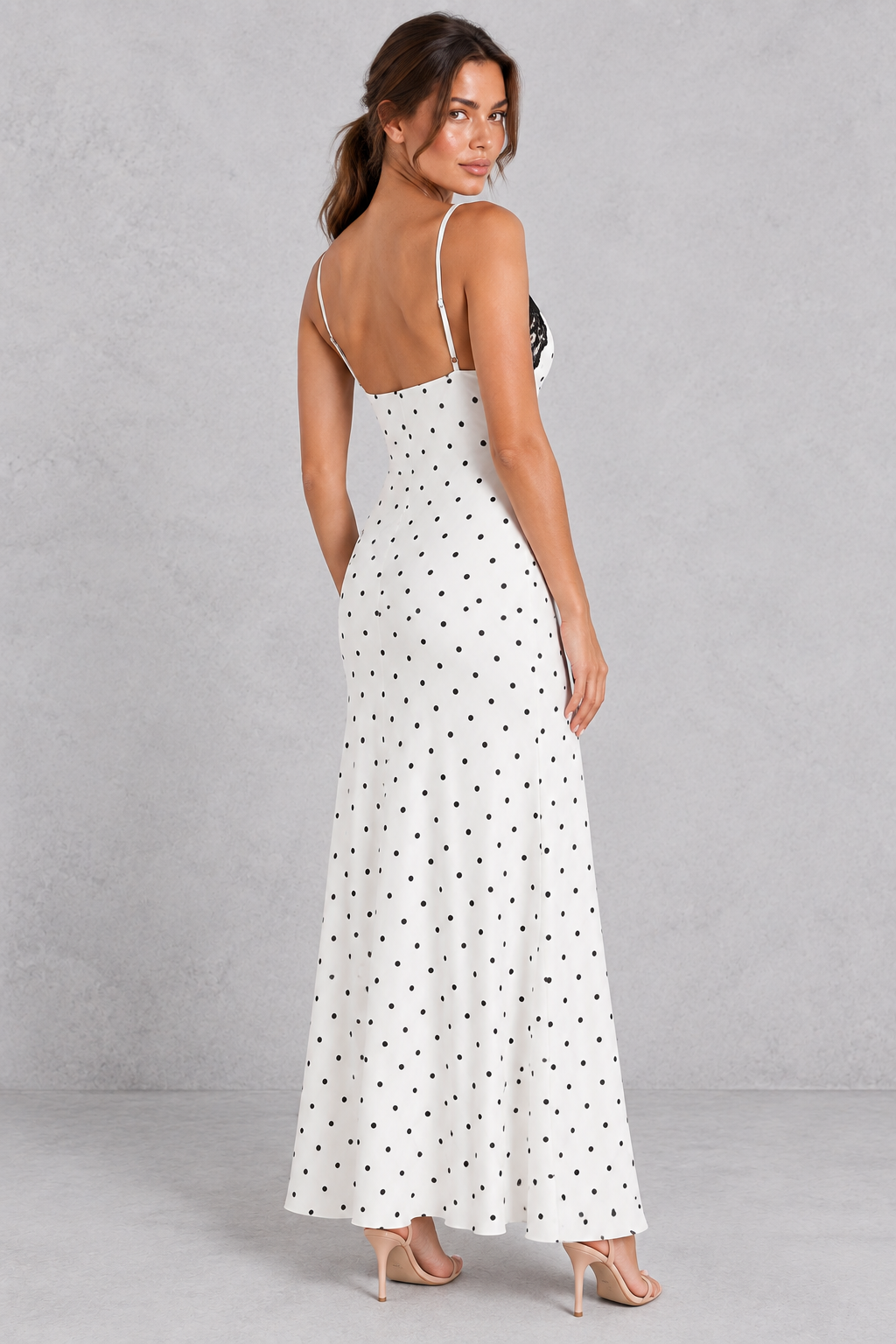 Close-up of contrast lace patchwork on a women's spaghetti strap maxi dress.
