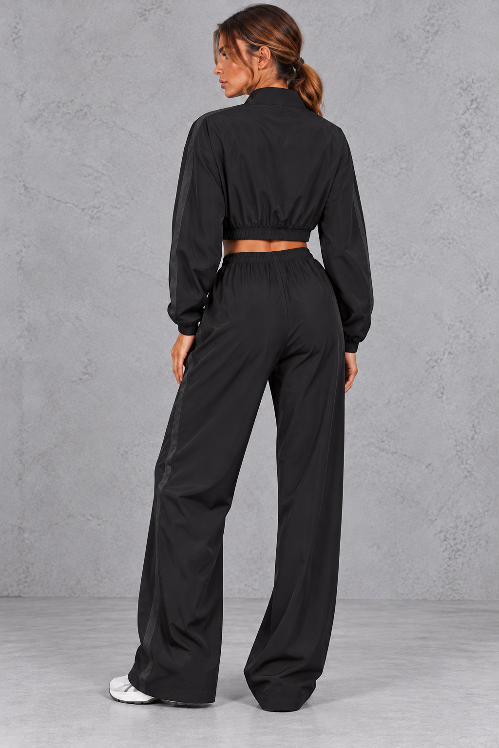 Activewear set worn with the jacket open over a sports top