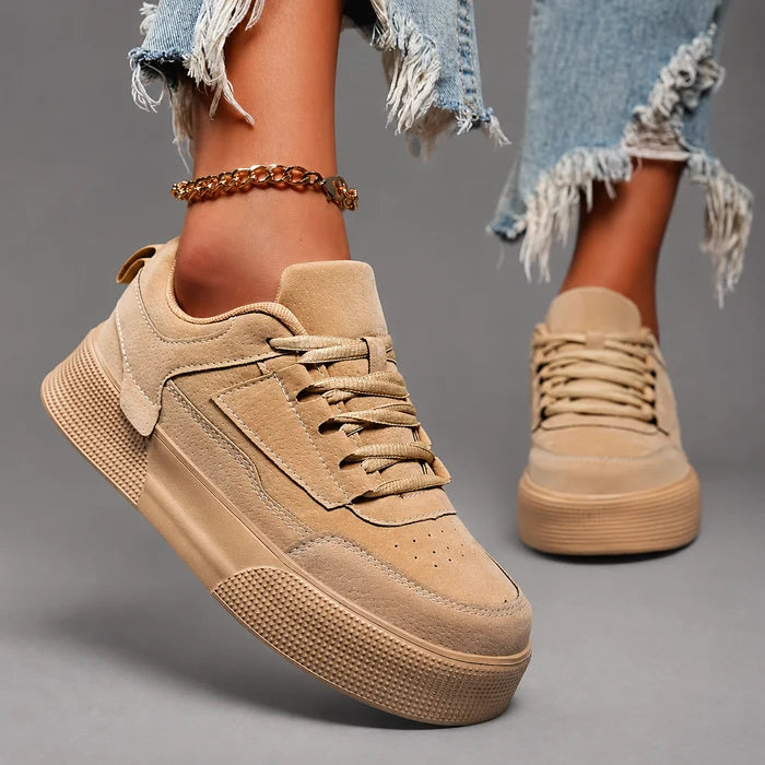 Women’s round toe lace-up sneakers with a lightweight low-top design, cushioned insole, breathable construction, and flexible durable outsole.