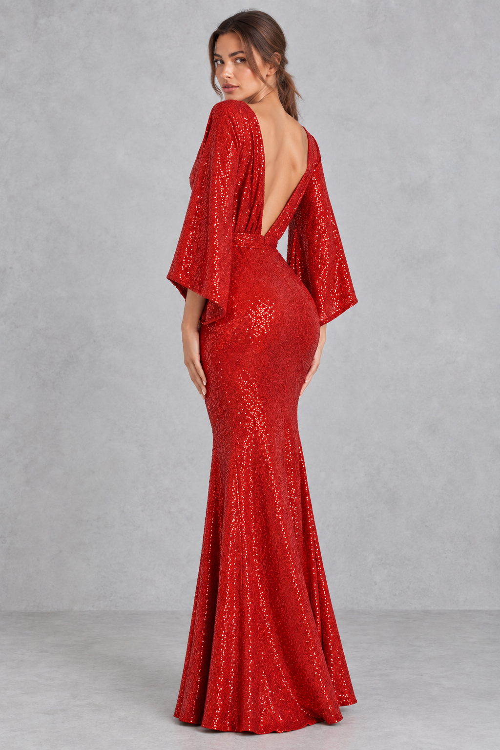 Close-up of the shimmering red sequins and V-neckline on a formal party dress.