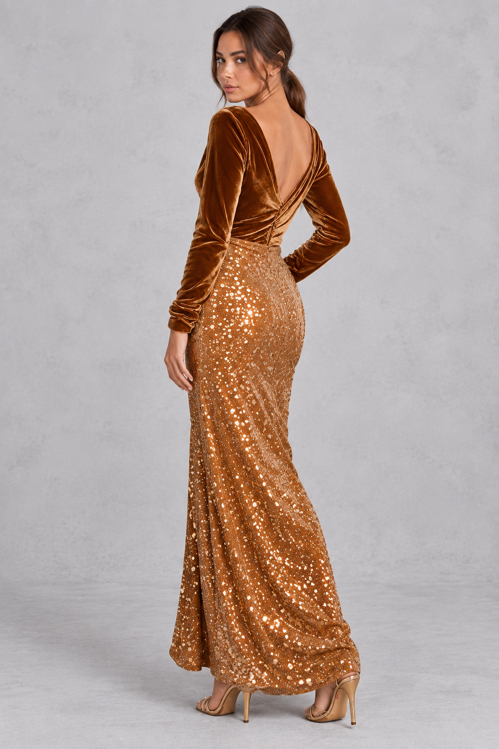 Model in a long sleeve brown velvet sequin dress, styled with heels for an evening party.