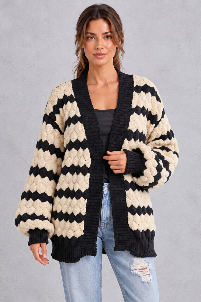 Women's striped chunky knit cardigan with puff sleeves, front view