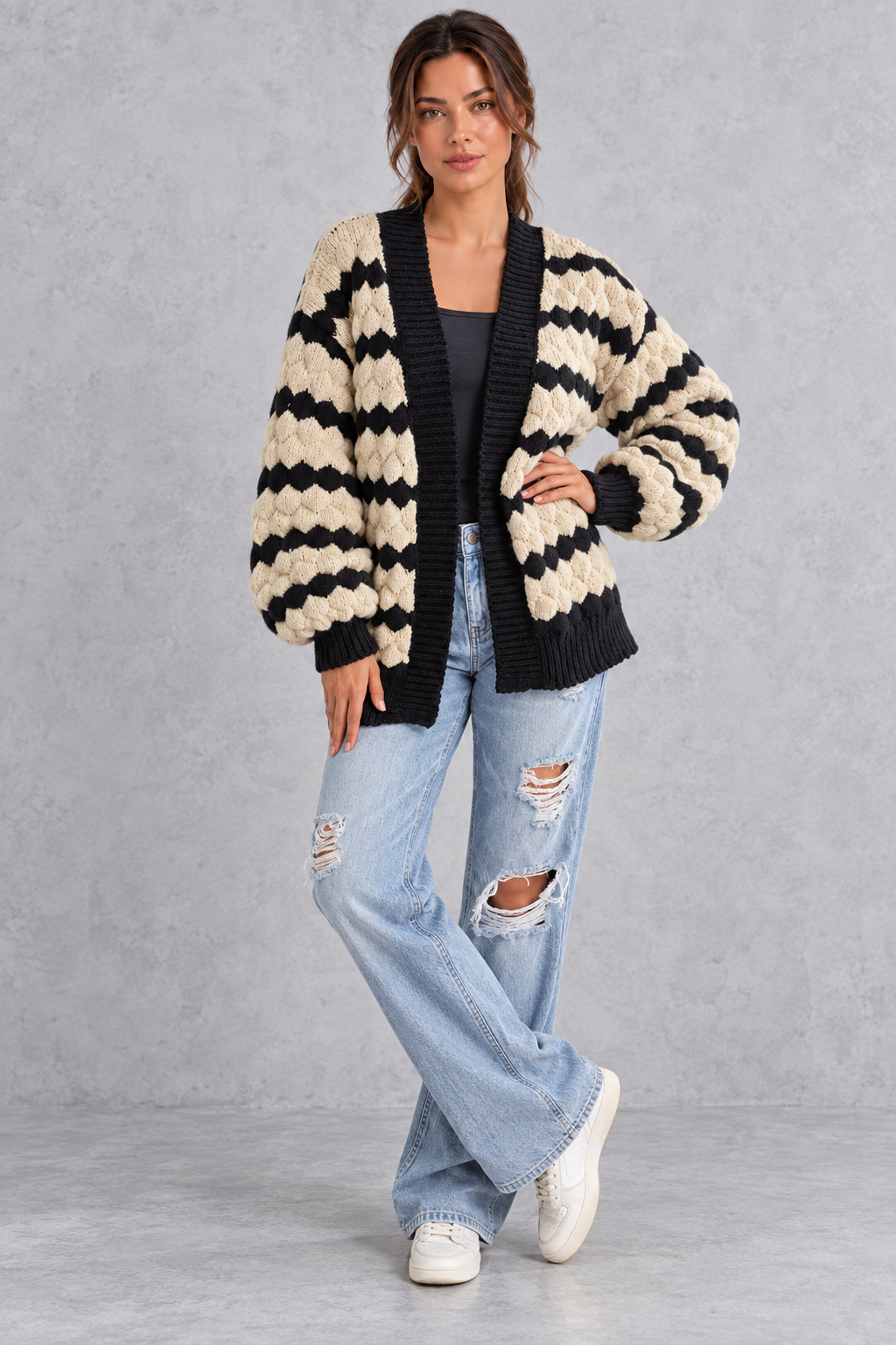 Back view of relaxed striped chunky knit cardigan