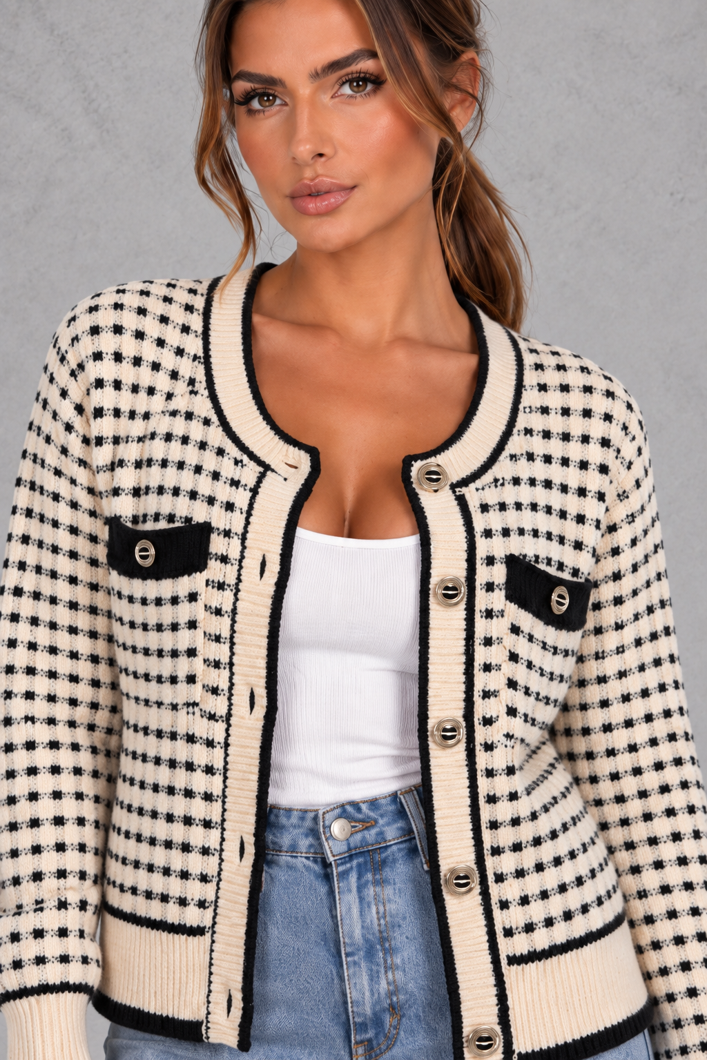 Close-up of gold-tone buttons and contrast edging