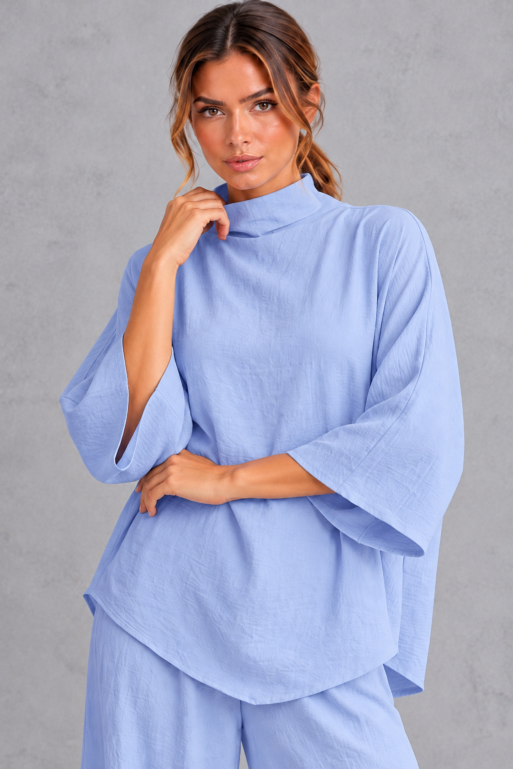 Close-up of the high turtleneck and textured twill fabric