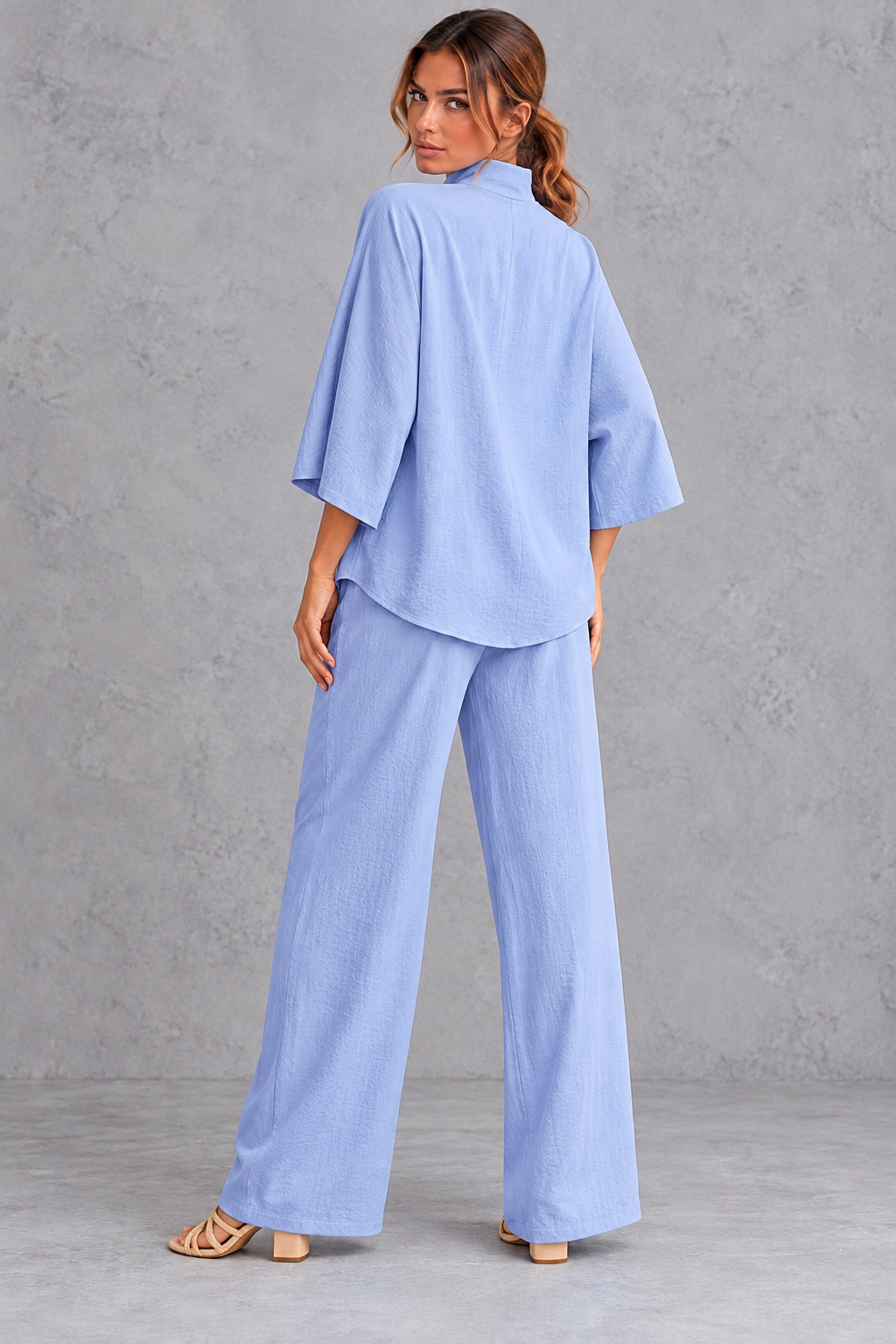 Wide three-quarter sleeve detail on the oversized blouse