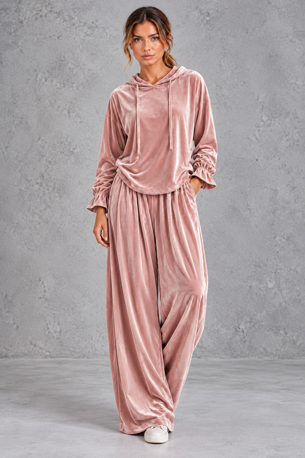 Side view of the velvet tracksuit showing dropped shoulders and wide leg