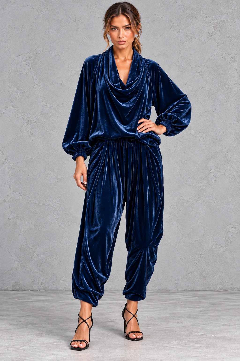 Styled evening look wearing the velvet two-piece set with heeled boots