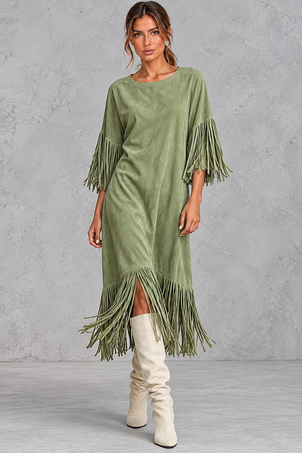Fringe hem detail on a women's boho faux suede dress